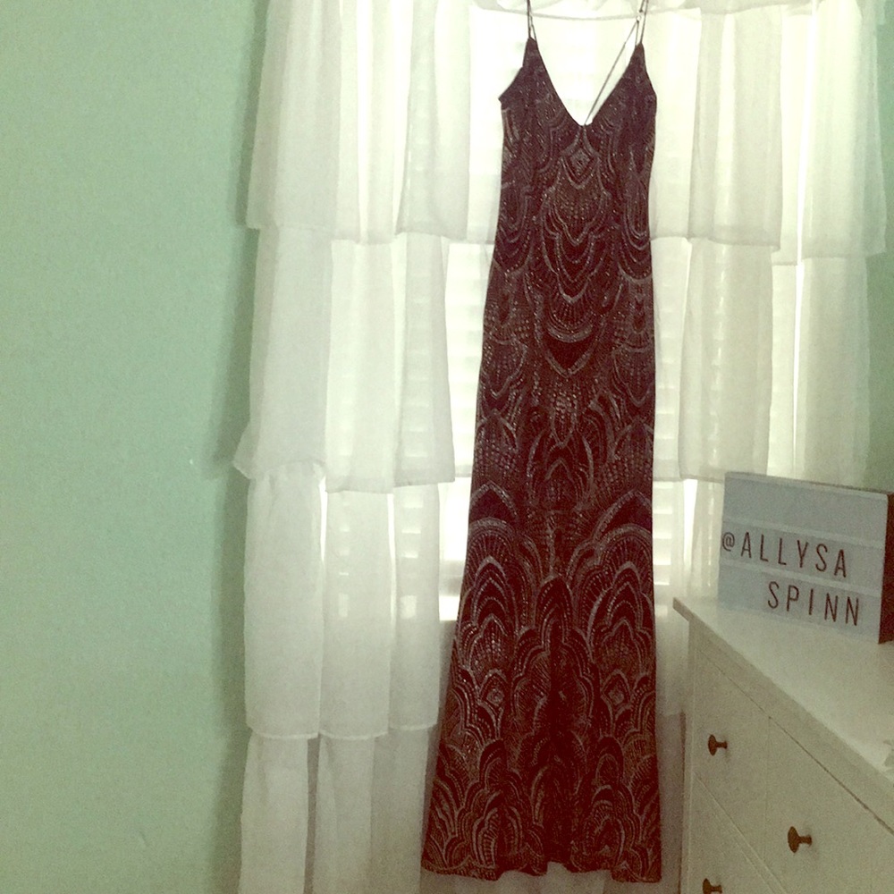 Long, fitted, rose gold and black prom dress